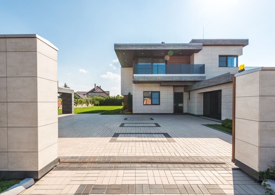 Clean block-paved driveway in front of a house