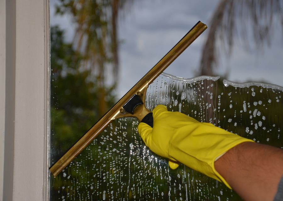 Window being cleaned with a squeegee